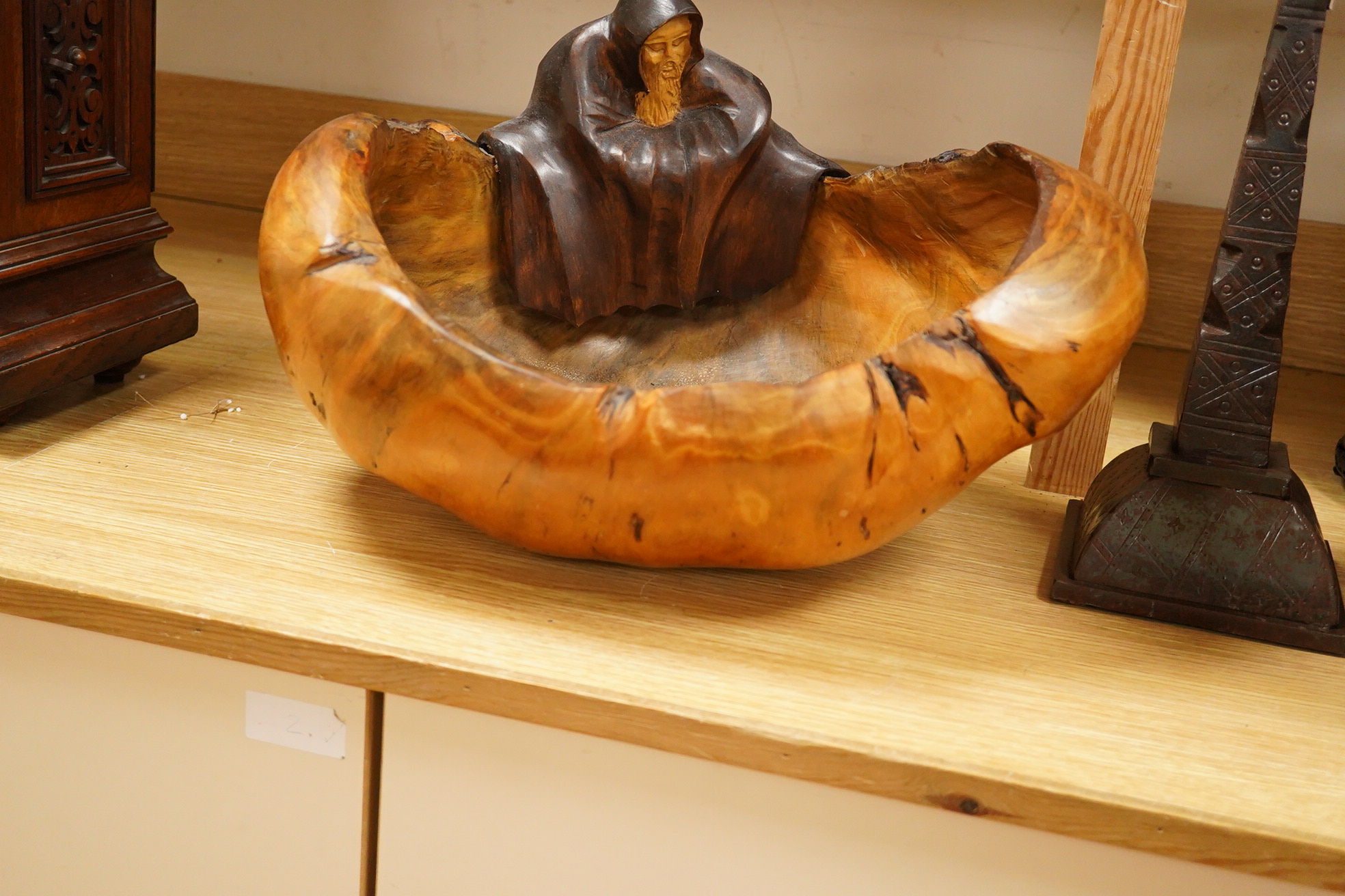 Pierre Decorse (b.1953), a large naturalistically modelled bowl carved with a cloaked figure, 42cm wide